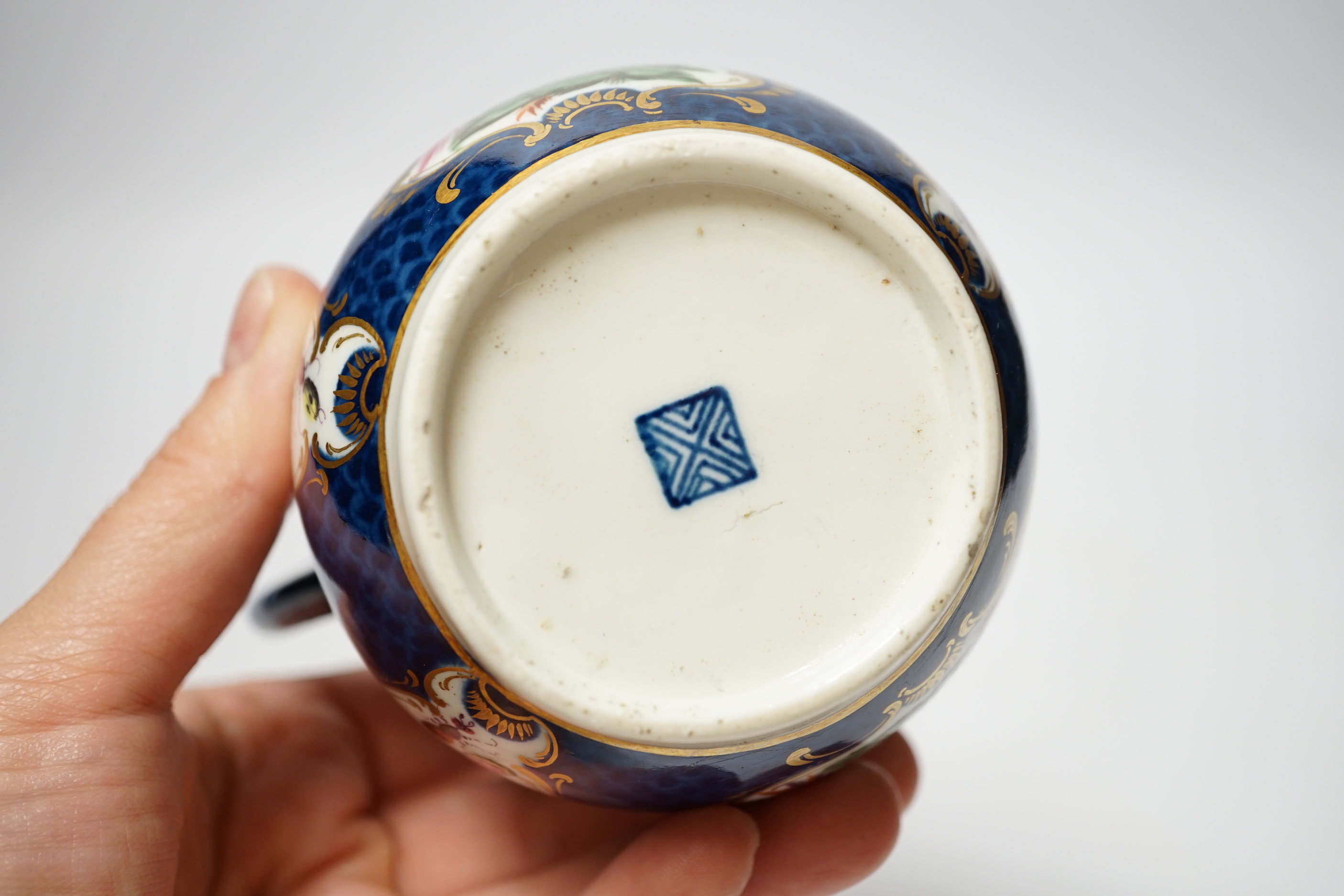 An 18th century Worcester blue scale jug, 11cm